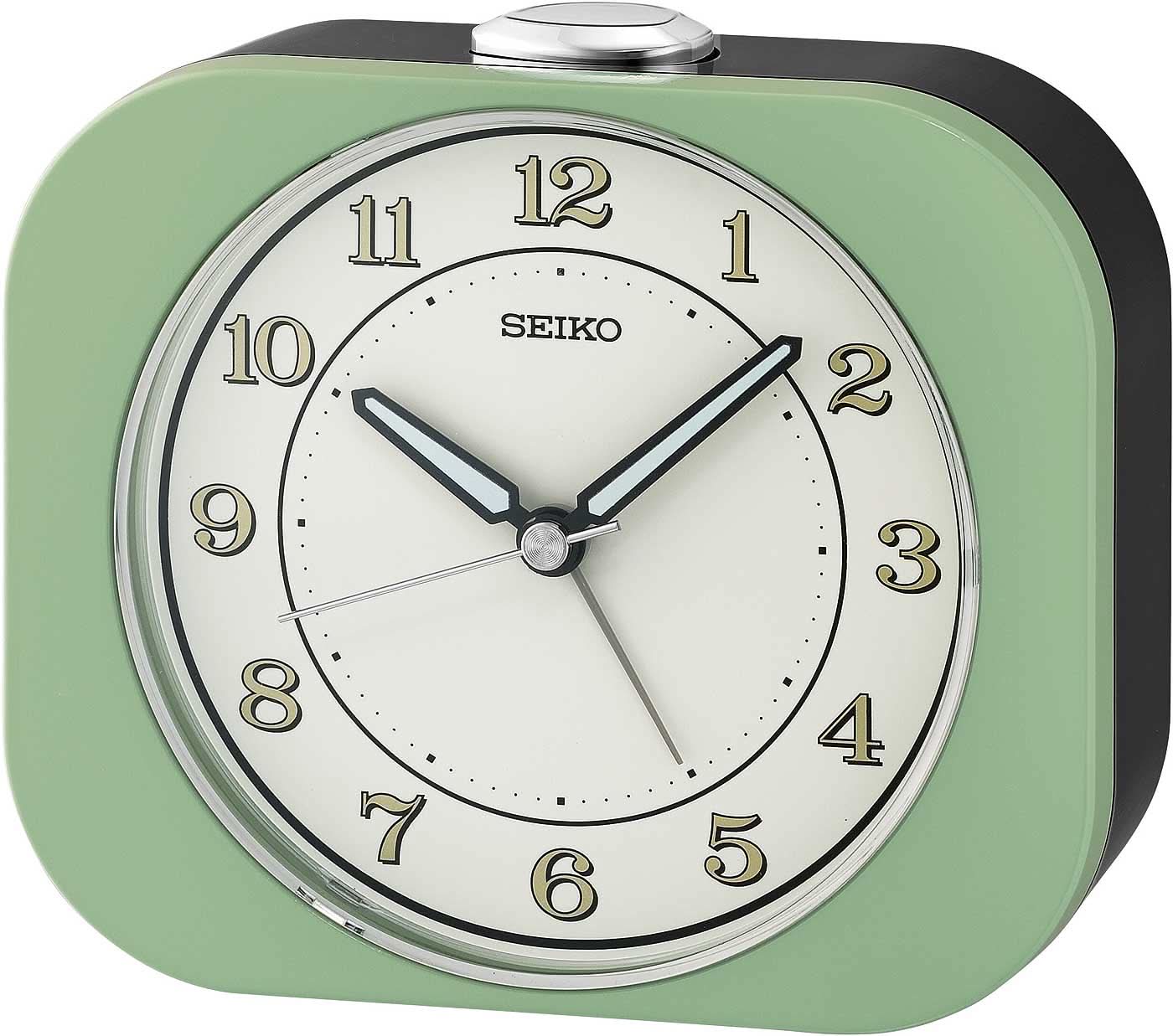 Seiko klassisk väckarklocka med grönt plastfodral, rund vit urtavla och analoga visare