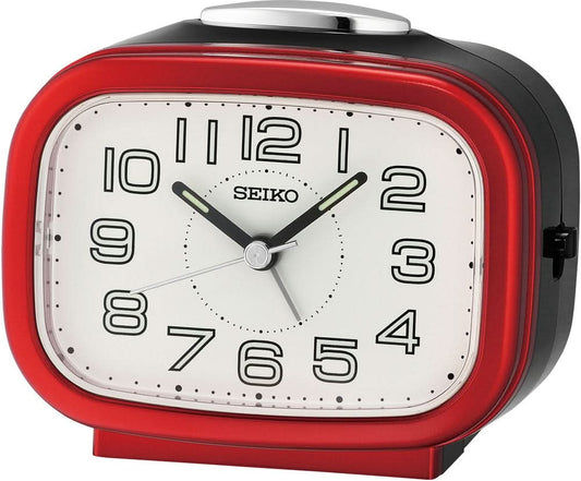 Seiko analog väckarklocka med vit urtavla, svarta visare och rött hölje.