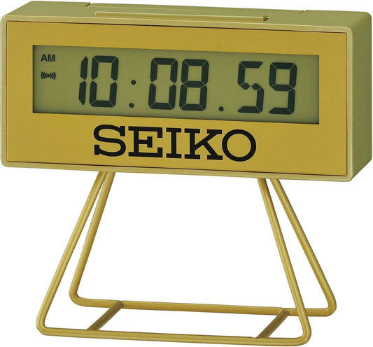 Digital Seiko-väckarklocka, guldfärgad boett i resin, gul display, stativ