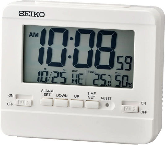 Digital väckarklocka i plast med stor LCD-display, knappar och reglage, AM/alarm-indikator