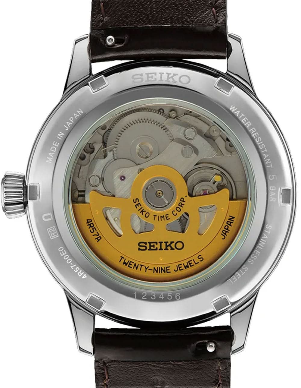 Seiko Presage herrklocka med öppen baksida, guldfärgad automatisk urverk och brunt läderband.