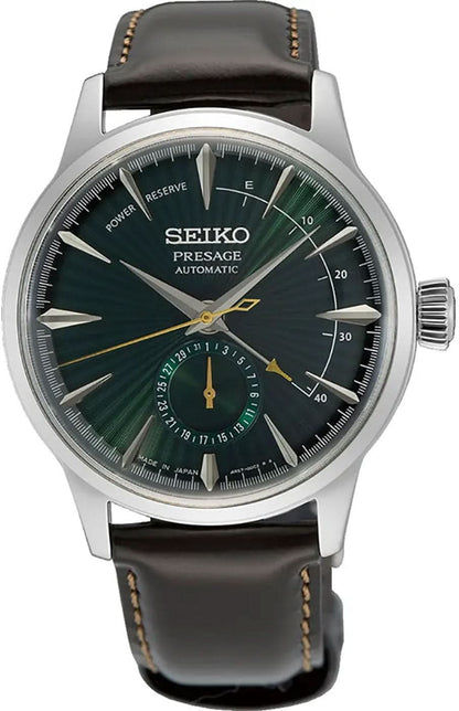 Seiko Presage herrklocka med mörkgrön urtavla, silverfärgat hölje och brunt läderband.
