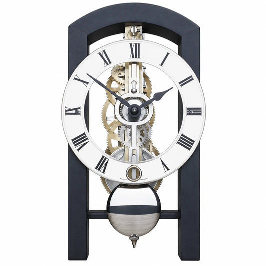 Mörkblå bordsklocka med öppet urverk, vit urtavla och romerska siffror