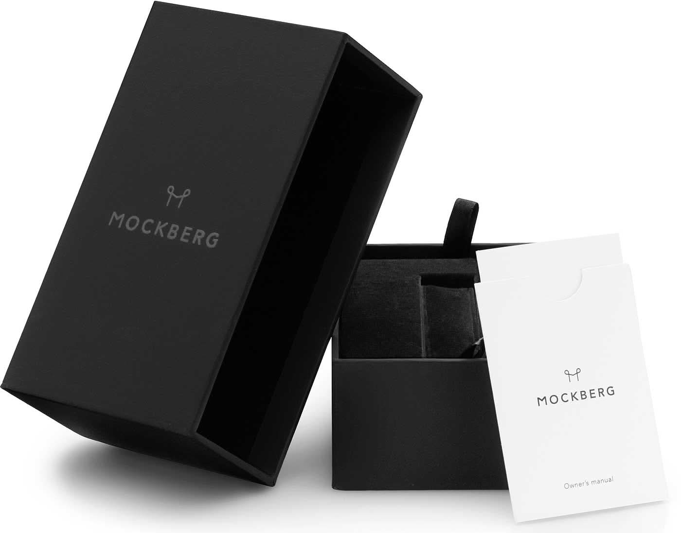 Klockförpackning: svart ask och vitt kort med MOCKBERG-logotyp