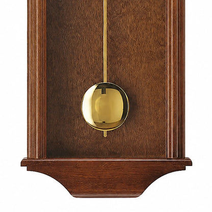 Wanduhr mit rundem Messing-Pendelaufsatz im Nussbaumgehäuse