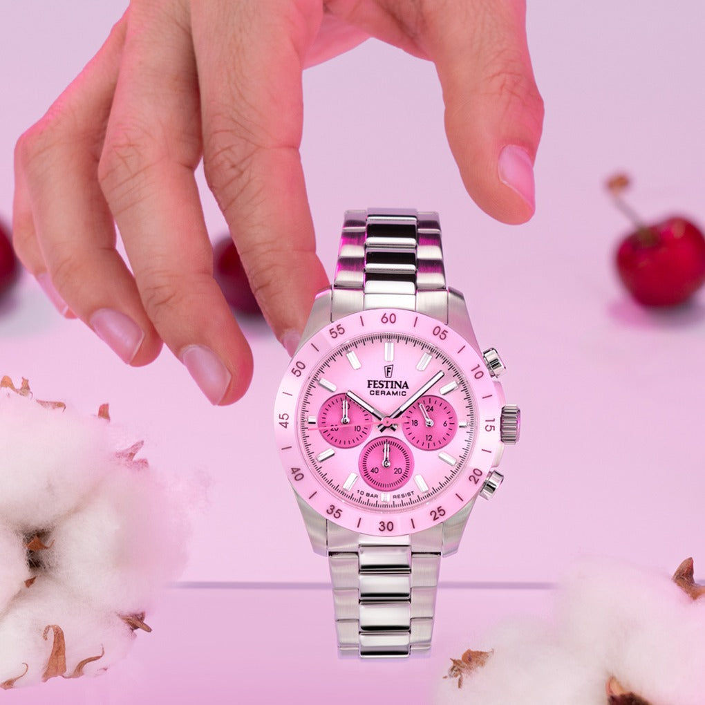Uniseksowy zegarek typu chronograf z różową tarczą, srebrną metalową bransoletą i przyciskami z boku koperty