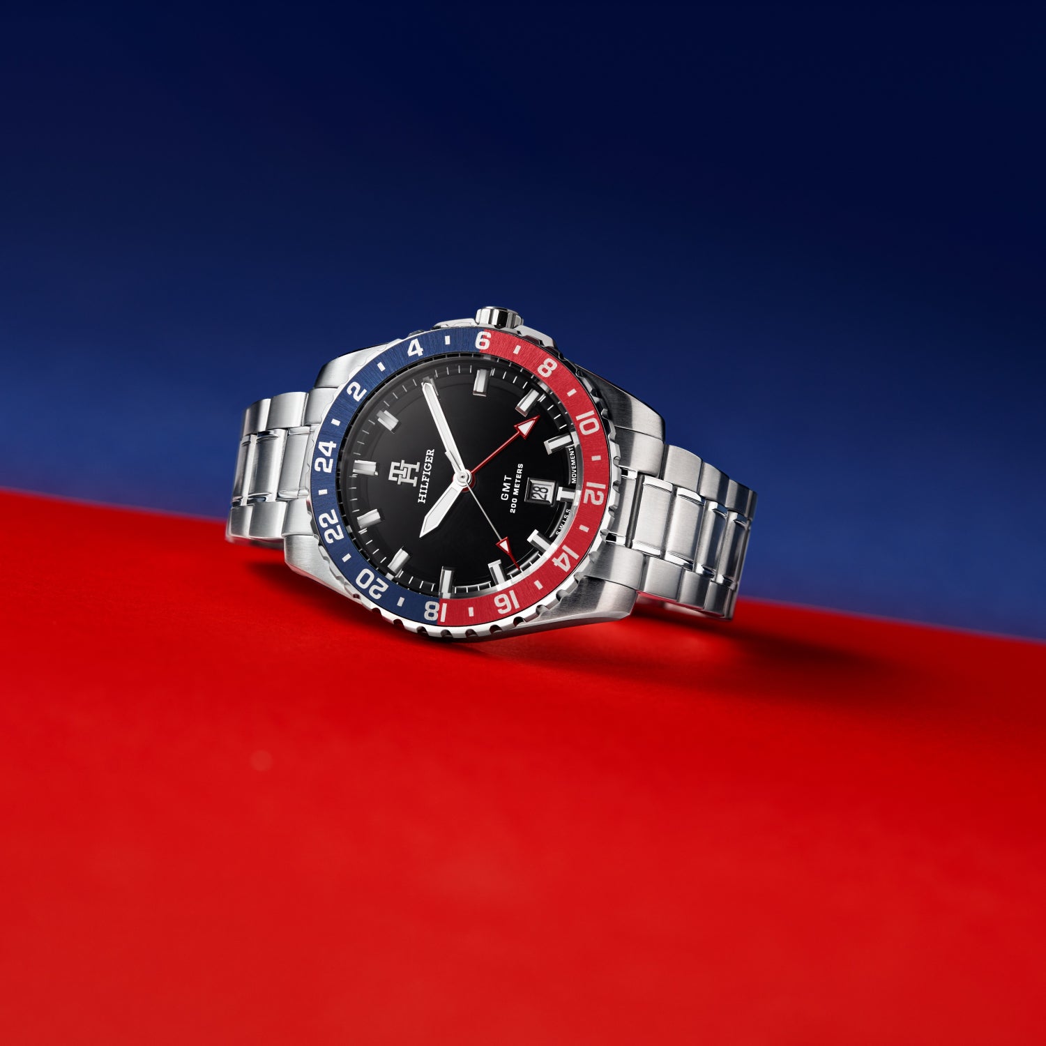 Damski zegarek na rękę z czarną tarczą i niebiesko-czerwoną ramką lunety, bransoleta ze stali szlachetnej