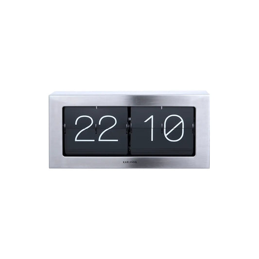 Tischuhr mit Klappzahlen-Mechanismus im rechteckigen Stahlgehäuse, Anzeige „22 10“.