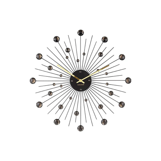 Schwarze Wanduhr mit Kristallstrahlenkranz und goldenen Zeigern