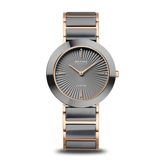 Damenuhr mit grauem Keramikgehäuse, roségoldfarbenem Gliederarmband und schwarzem Zifferblatt