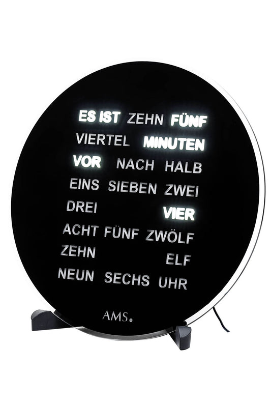 Schwarze runde Wanduhr mit Schriftziffern und zwei Standfüßen