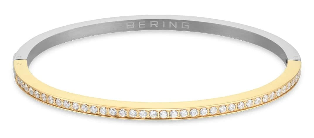 Pulsera de acero inoxidable con borde acentuado en color dorado y circonitas brillantes