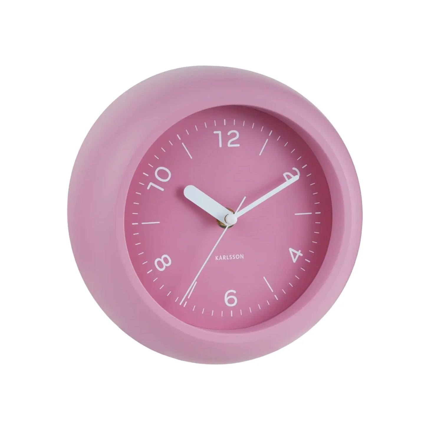 Rosafarbene runde Wanduhr mit pinkem Zifferblatt, weißen Zeigern und 12‑Stunden‑Skala