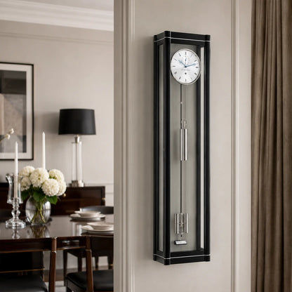 Reloj de pared con marco negro y fondo gris, esfera redonda, péndulo