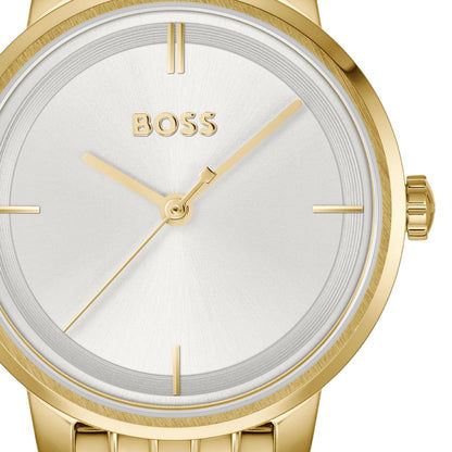 Goldene Armbanduhr im Detail: weißes Zifferblatt mit Strichmarkern und BOSS