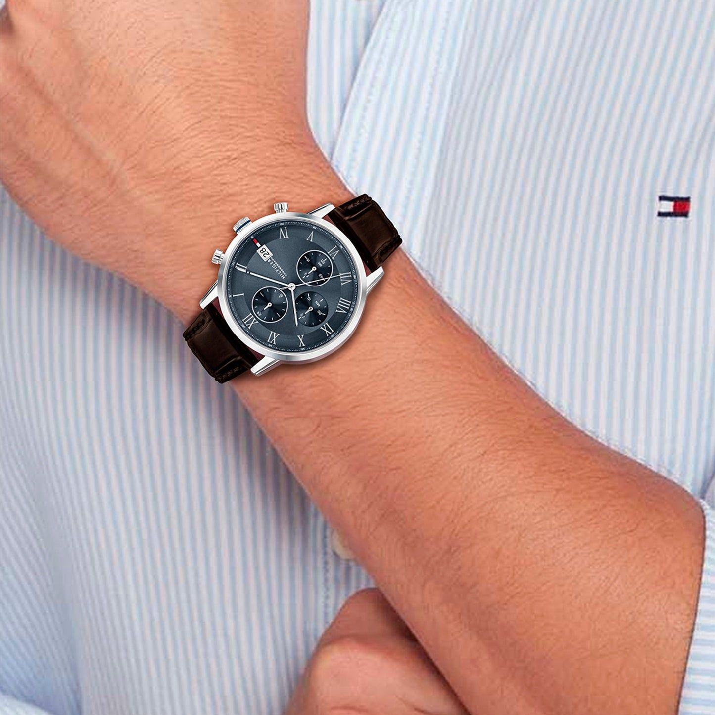 Tommy Hilfiger Chronograph am Handgelenk: braunes Lederband, dunkles Zifferblatt mit Chrono