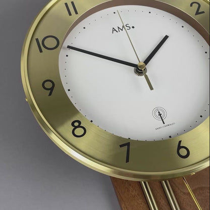 AMS Wall Clock 62x22x8 cm Wood • Radio-Controlled Pendulum Movement • Arabic Numerals