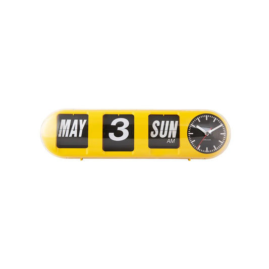 Leuchtgelbe Tube-Flip-Wanduhr mit „MAY“, „3“, „SUN AM“ und kleinem Ziffernrad