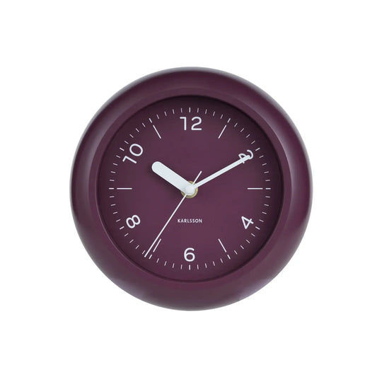 Frontansicht der Wanduhr: Dunkelmauve-Rahmen, dunkles Zifferblatt mit weißen Ziffern und Zeigern