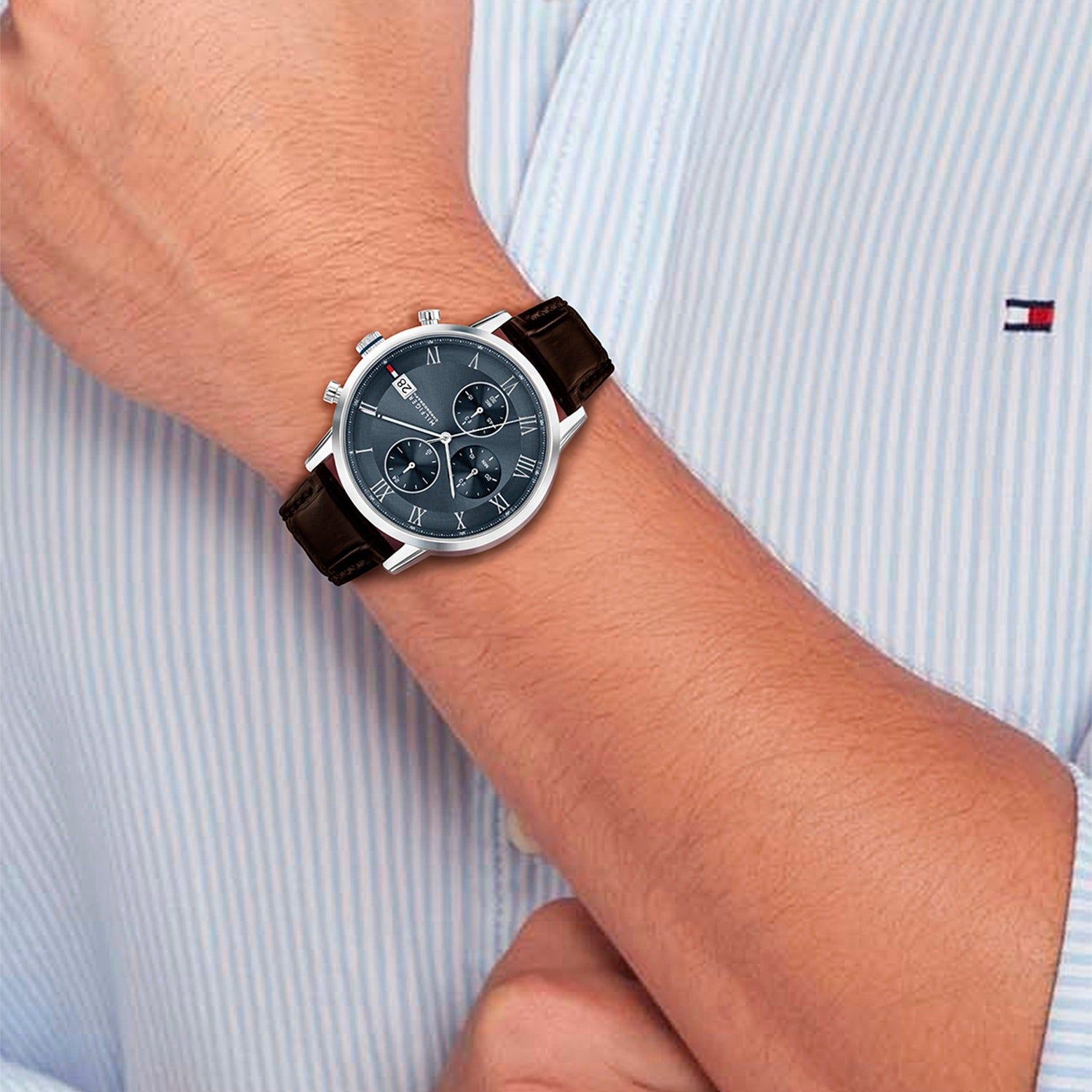 Tommy Hilfiger Chronograph am Handgelenk: braunes Lederband, dunkles Zifferblatt mit Chrono