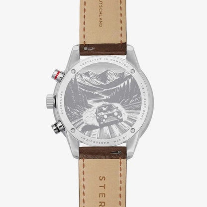Herrenuhr mit silbernem Gehäuse, braunem Lederarmband und Relief-Zifferblatt
