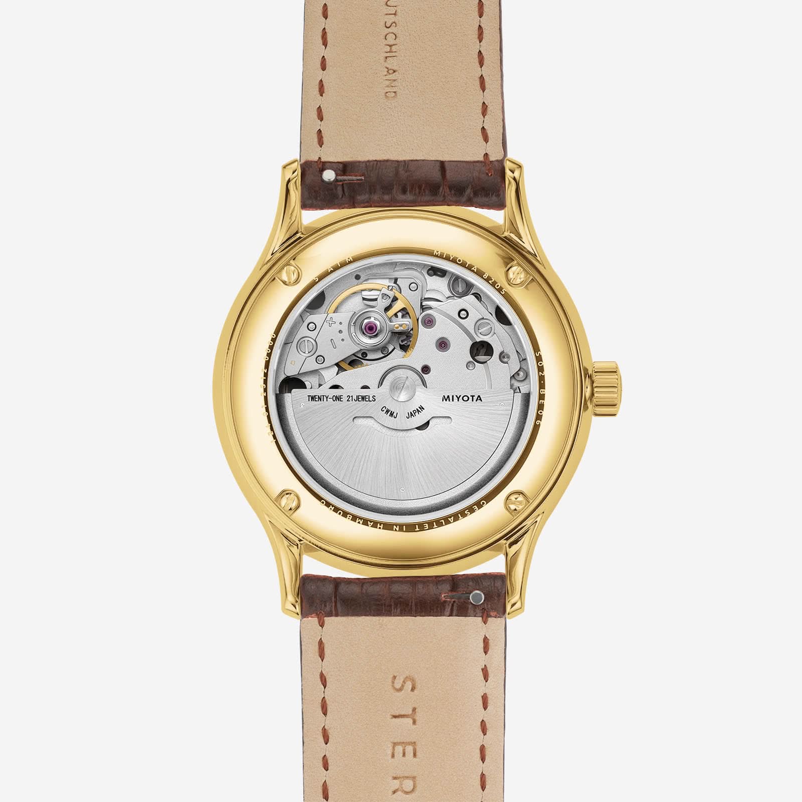 Herrenarmbanduhr, geöffnetes Sichtfenster mit Uhrwerk; beiges Lederband
