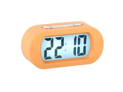 Cyfrowy budzik w kolorze miękkiego pomarańczu z dużym wyświetlaczem LCD, widoczna godzina